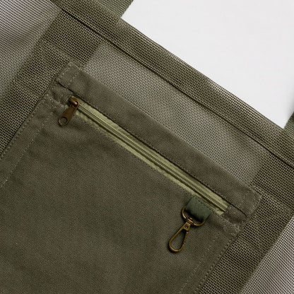 Sande Kids original mesh beach bag in army green. Showing internal secure canvas pocket and key clip.