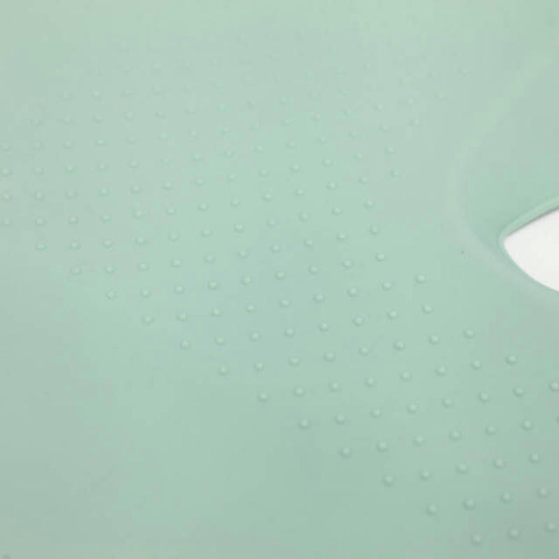 Grip detail on the underside of the Sande Kids™ pram and car seat liner made from moulded silicone. Colour is Seafoam green.