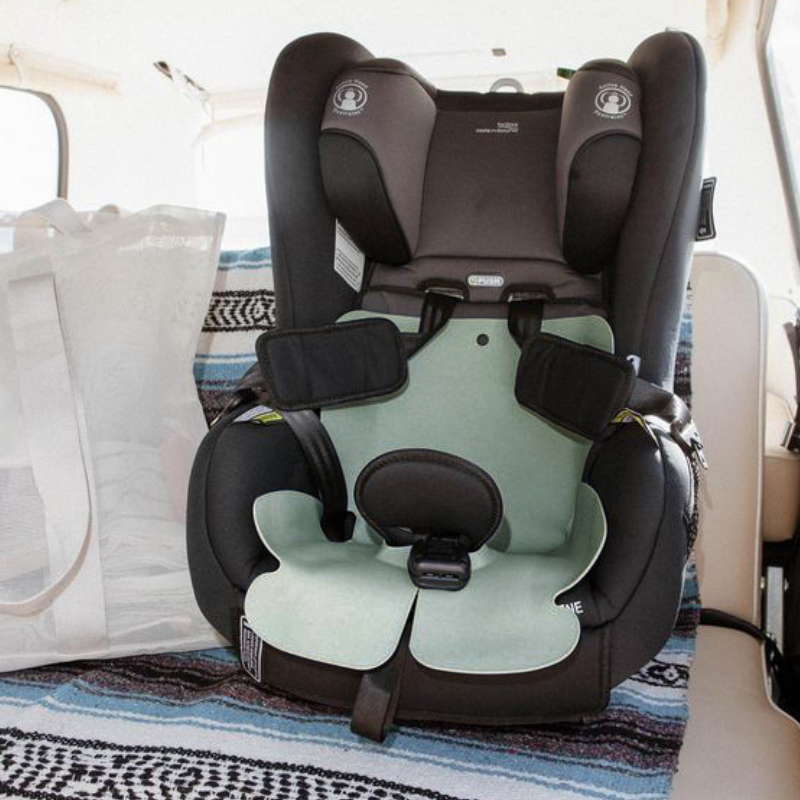 Britax forward-facign carseat with a Seafoam Green silicone car seat liner by Sande Kids™ used to protect the seat fabric from messes.