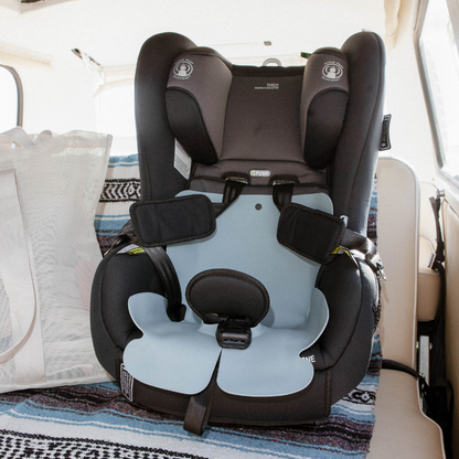 The Sande Kids™ Waterproof Car Seat and Pram Liner made from food grade silicone in Ocean Blue, shown in a forward-facing Britax Car Seat. 
