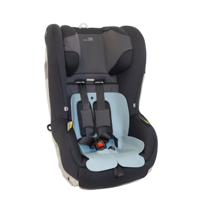 Sande Kids™ Waterproof Car Seat and Pram Liner made from food grade silicone. Sitting in children's forward-facing car seat. Colour - Ocean Blue.