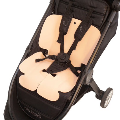 Sande Kids™ Waterproof Pram liner shown sitting in stroller. Colour Coral Pink.